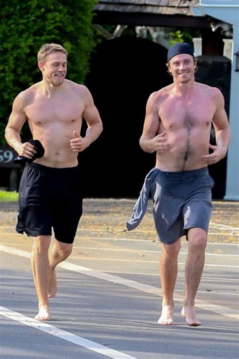 shirtless charlie hunnam and garrett hedlund show off muscles on barefoot run in hawaii