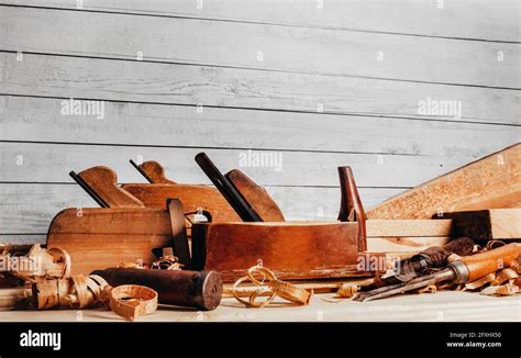 Photo Of Wooden Old Fashioned Planes With Carving Chisels Laying On