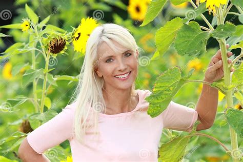 mature woman with sunflowers stock image image of mature summer 86093985