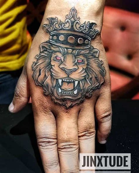 Lion With Crown Tattoo On Hand 1 Crown Hand Tattoo Lion Tattoo With