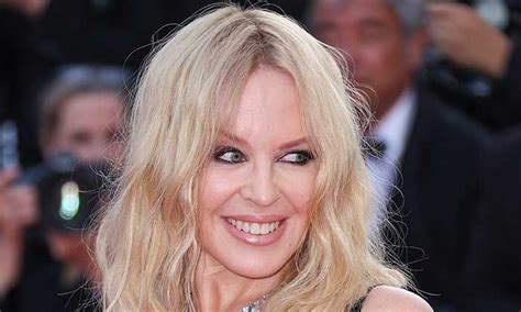 Kylie Minogue Stuns In White Feathered Sequin Dress To Mark Special