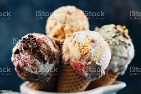 Pistachio Chocolate Strawberry And Vanilla Ice Cream In A Cone Stock Photo Download Image Now