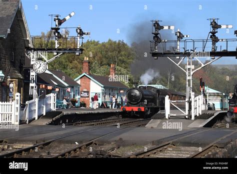 Steam Train With Carriages About To Depart From Grosmont Station On The