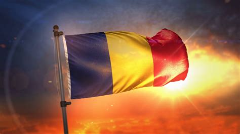 Free Download Romania Flag Backlit At Beautiful Sunrise Loop Slow