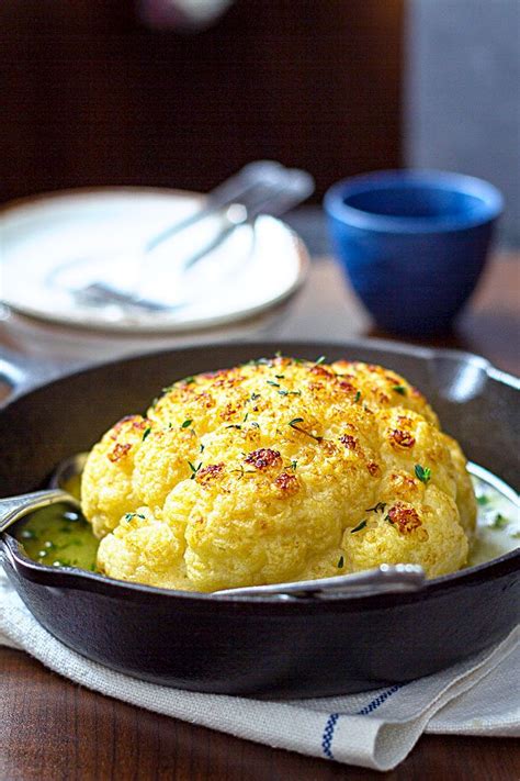 Put 1 tablespoon of the olive oil into a pie plate and rub it around. Whole Roasted Cauliflower With Butter Sauce — Eatwell101
