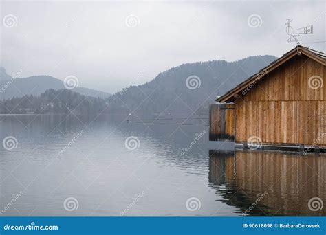 Beautiful Wooden Boathouse Floating On Lake Bled In Fog Winter Scenery