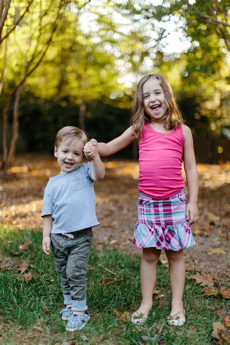 Young Brother And Sister Being Goofy Outside By Jakob Lagerstedt