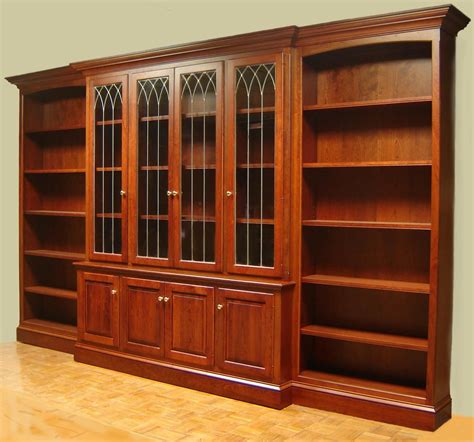 handmade cherry bookcase with leaded glass doors and open side bookcases by odhner and odhner fine