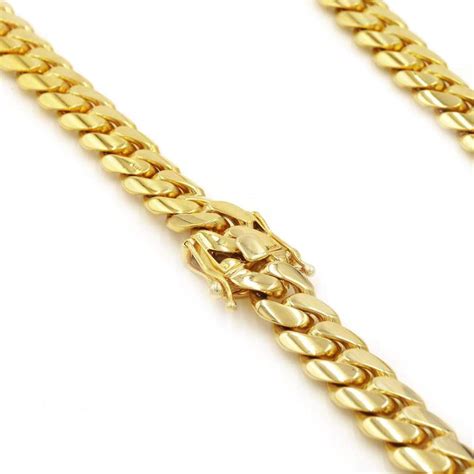Great for layering, this cuban choker will add a charming vibe to any look. 11mm Cuban Link Chain in 14K Solid Gold | Las Villas Jewelry