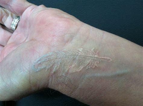 Stylish white ink bird finger tattoo. 75 White Ink Wrist Tattoos