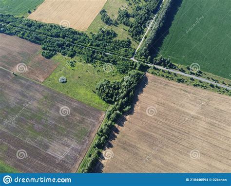 Crossroads Of Two Roads Among Farm Fields Aerial View Agrarian