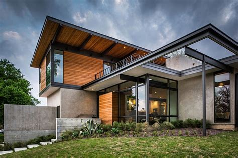 Steel And Glass Frame Of The Modern House Extends The Living Space