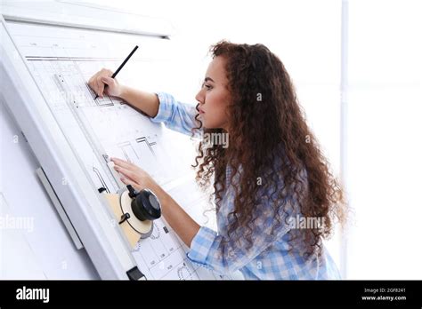 Female Architects Working On Blueprints Stock Photo Alamy