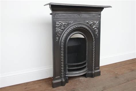A small and decorative victorian cast iron bedroom fireplace. Antique Victorian Arched Cast Iron Bedroom Fireplace For ...
