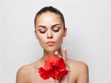 Woman Naked Shoulders Red Flower Near Face Cosmetics Cropped View Stock