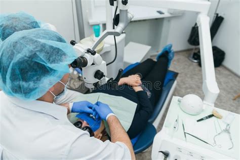 Doctor Used Microscope Dentist Is Treating Patient In Modern Dental