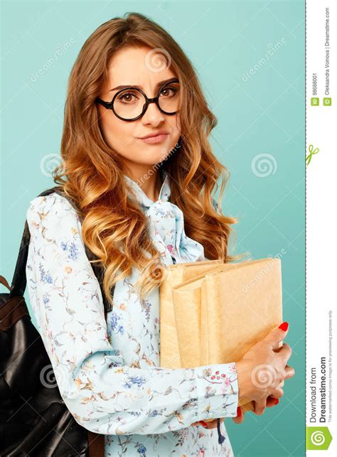 Portrait Of A Thoughtful Girl Wearing Glasses Pretty Student Holding