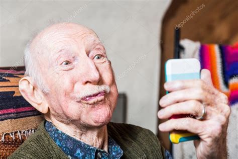Older Man Taking Silly Face Selfie — Stock Photo © Creatista 80665208