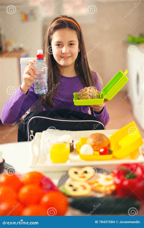 Girl Puts A Snack In A Bag For School Stock Photo Image Of Female