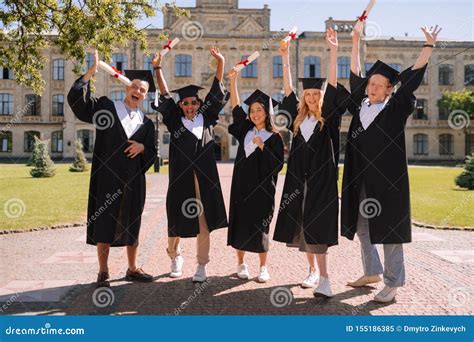 Happy Students Standing In Front Of The University Stock Image Image