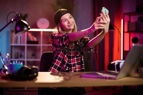 Happy Cheerful Woman In Checkered Shirt Taking Selfie On Modern