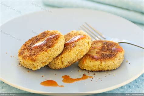 A delicious piece of heavenly angel food cake against a rich, vibrant blue background. Cheddar Salmon Cakes Recipe | RecipeLand.com