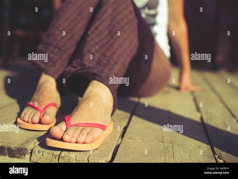 Foot In Thongs On The Beach Stock Photo Alamy
