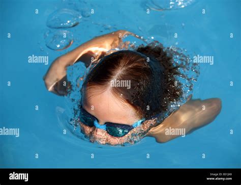 Child Diving In A Swimming Pool Stock Photo Alamy