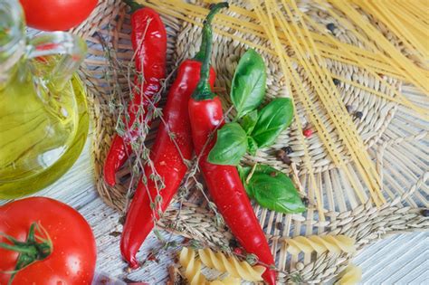 Italian Food Background With Tomatoes Basil Pasta Olive Oil Chili