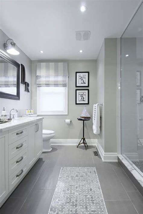 On the floors, carrara venato 2 octagon polished mosaic tile, on the walls, white glass subway tile with rope trim, and finally, on the shower and recessed shelf, carrara bianco polished 3 hexagon marble mosaic tile. 37 light gray bathroom floor tile ideas and pictures 2020