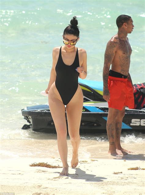 Kylie Jenner Shows Off Her Curvy Figure In A Black Swimsuit As Tyga