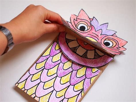 Punch holes on both sides of the mask and attach an elastic string. Two Chinese New Year Dragon Crafts | Chinese new year ...