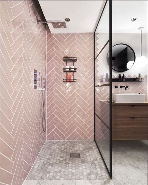 A Contemporary Bathroom With Pink Tiles Clad In A Herringbone Pattern