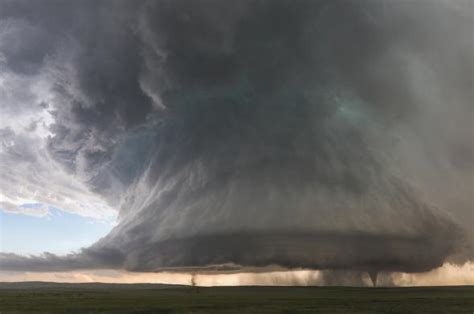 The rotating column, or vortex, forms inside the storm cloud (cumulonimbus), then grows downward until it touches. Tornado season: Rare photograph shows two tornadoes and ...