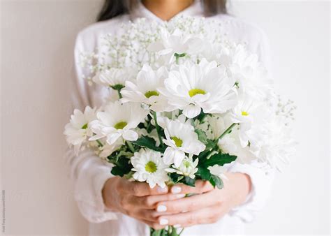 Young Woman Holding Beautiful White Flower Bouquet By Stocksy Contributor Nabi Tang Stocksy