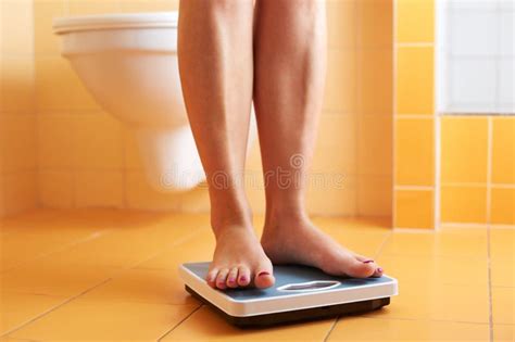 a pair of female feet on a bathroom scale stock image image of feet close 40921465