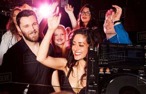 Group Of Young Men And Women Dancing In Nightclub Stock Photo Dissolve
