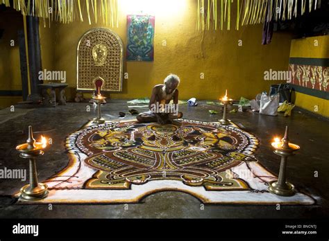 A Namboodiri Brahmin Priest Completes A Kalam Floor Image Of The Hindu