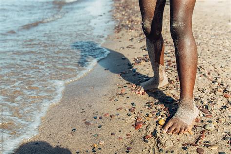black girl s sandy feet by a beach by stocksy contributor gabi bucataru stocksy