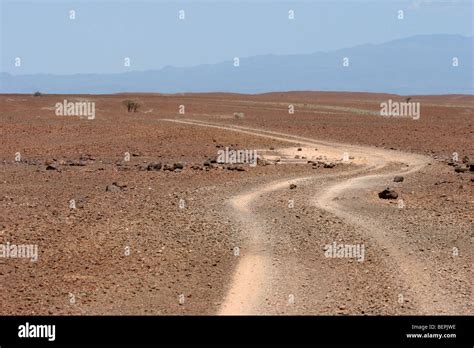 Dirt Road Through Dry Plains Of Northern Kenya East Africa Stock Photo