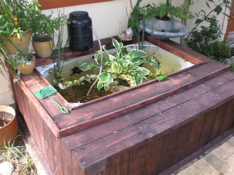 Front door pond built from old bathtub and tires. I was working on a bathtub pond at my old house. It's a ...