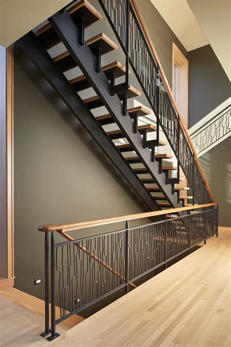 Contemporary Open Wood Staircase With Decorative Wrought Iron Rail