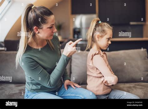 Angry Mother Is Scolding At Her Daughter Stock Photo Alamy