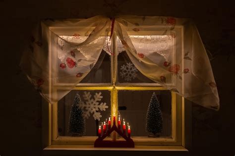 Premium Photo Christmas Decorations On Window Sill At Home During Night