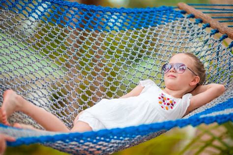 Adorable Girl In Hammock Outdoor At Tropical Vacation Stock Image