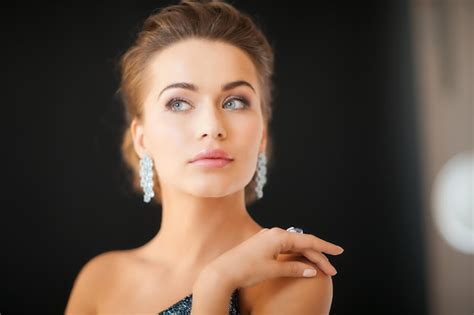 Premium Photo Beautiful Woman In Evening Dress Wearing Diamond Earrings