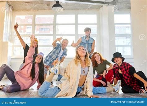 Group Of Young Modern People Posing Together With Fun In Studio Stock