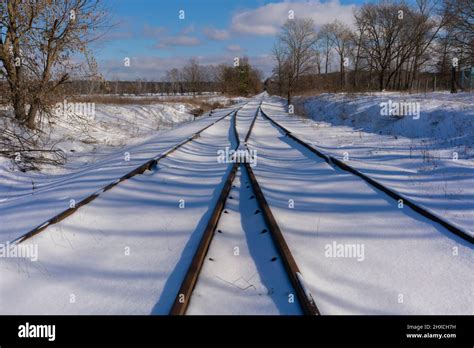 Old Unused Snowy Railway Tracks In Winter In Germany Hi Res Stock