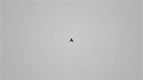 A Small Black Triangle On A Gray Background Wallpapers And Images