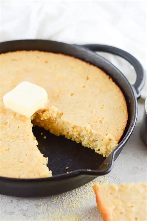 A Skillet With A Piece Of Cake In It Next To Some Cookies And Butter